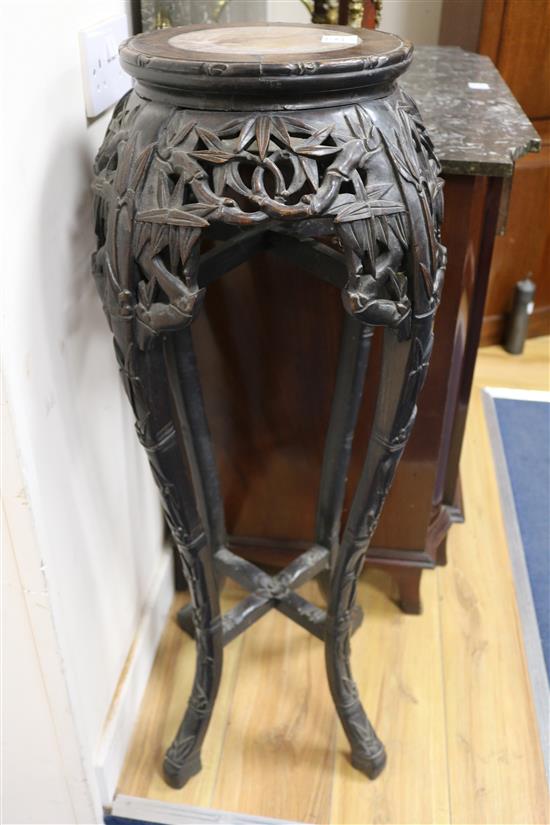 A Chinese carved hardwood marble inset jardiniere stand W.35cm
